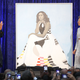 Former first lady Michelle Obama and artist Amy Sherald unveil her portrait during a ceremony at the Smithsonian’s National Portrait Gallery on Feb. 12, 2018, in Washington, D.C.